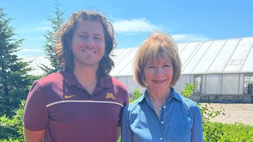 A photo of graduate student Manny Sabbagh and Senator Tina Smith at the University of Minnesota 